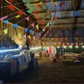 Inside the Bar Barn with bunting and decorations